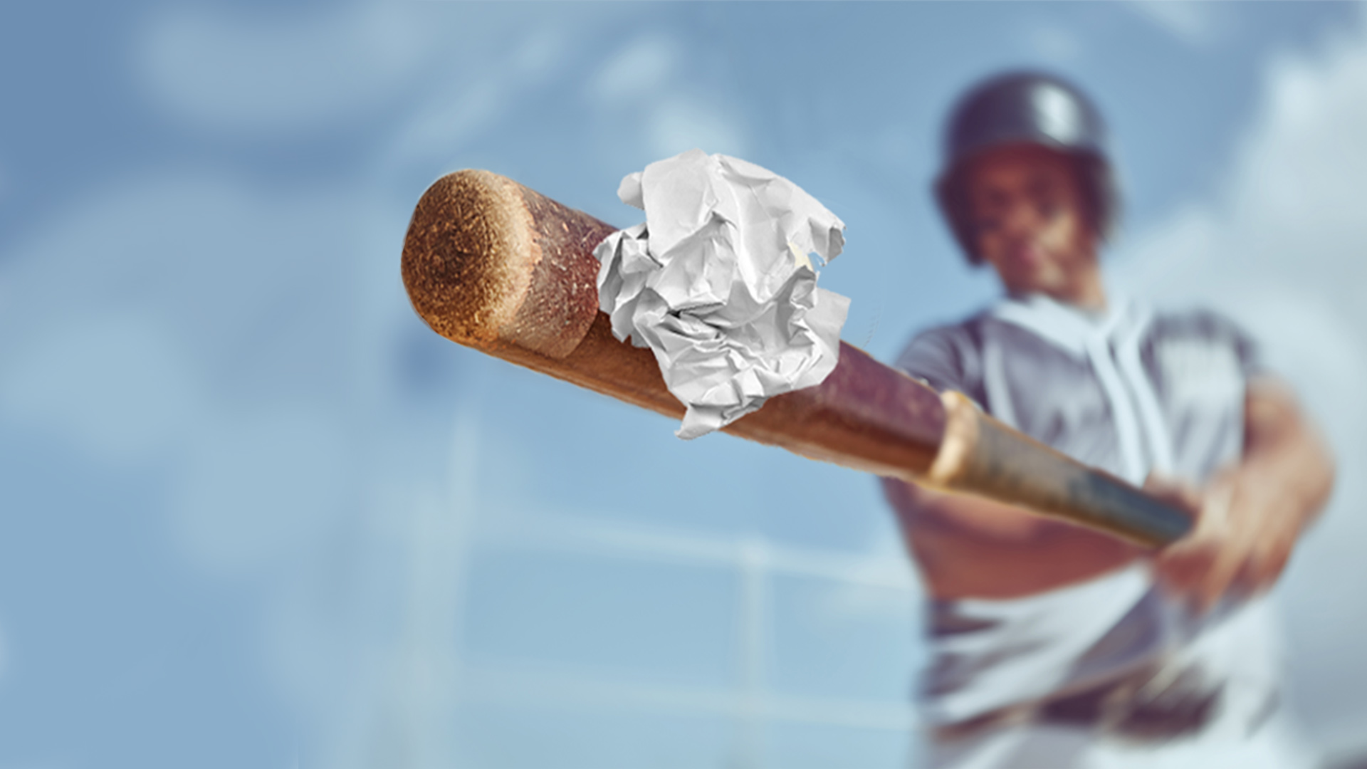 baseball bat hitting a ball of paper